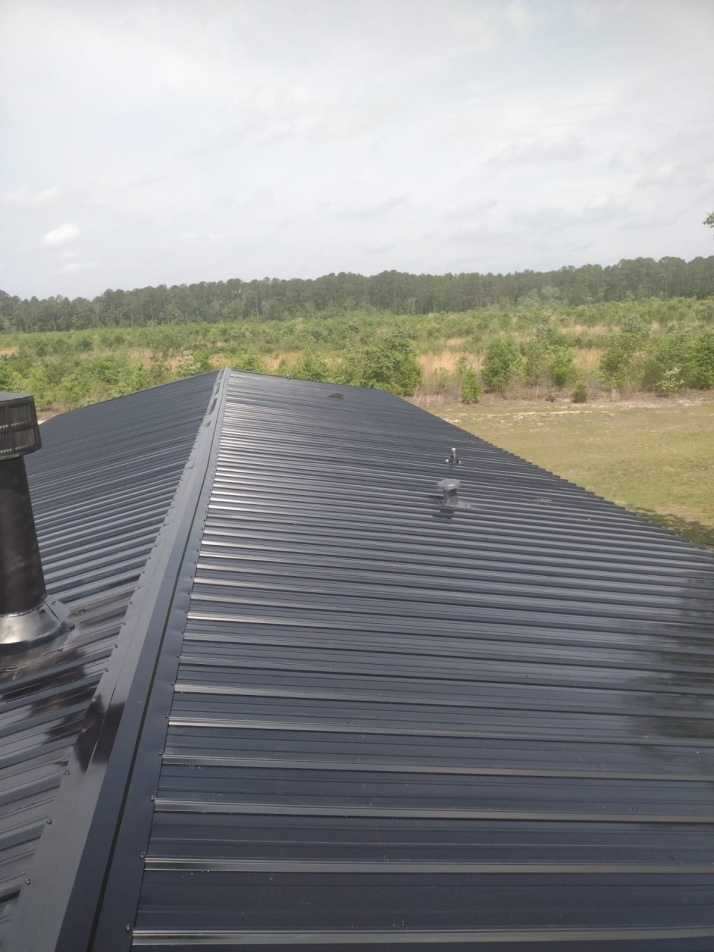 An image of a glossy black roof by Metal Roofing Color