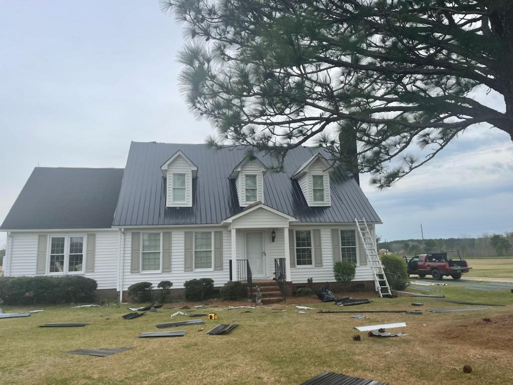 An image of a dark gray roof by Metal Roofing Color